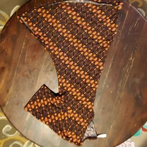 Orange and Black Lularoe top
